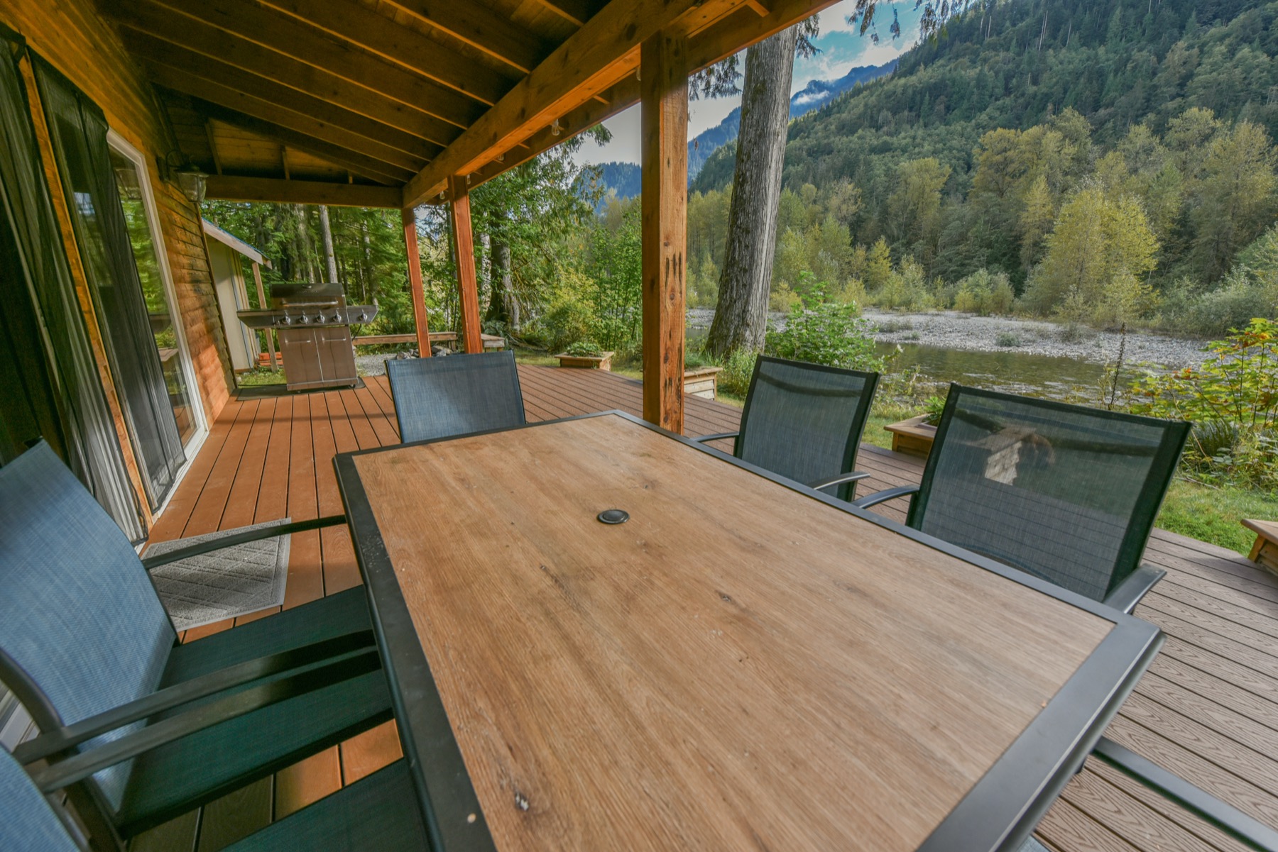 Covered deck at River's Edge Chalet overlooking the Skykomish valley
