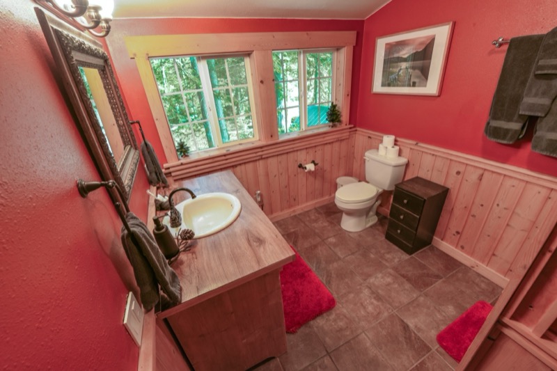 Upstairs bathroom with vanity and window