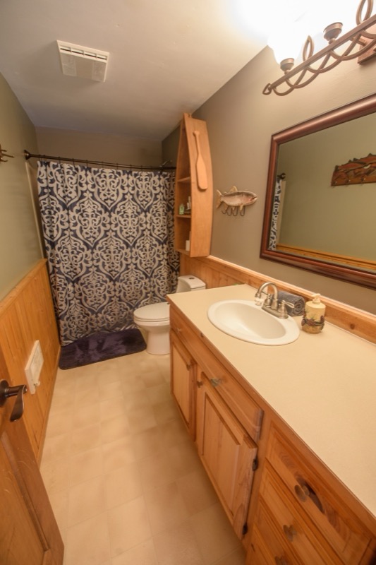 Bathroom with mirror and vanity