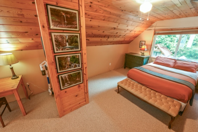 Loft bedroom with framed prints