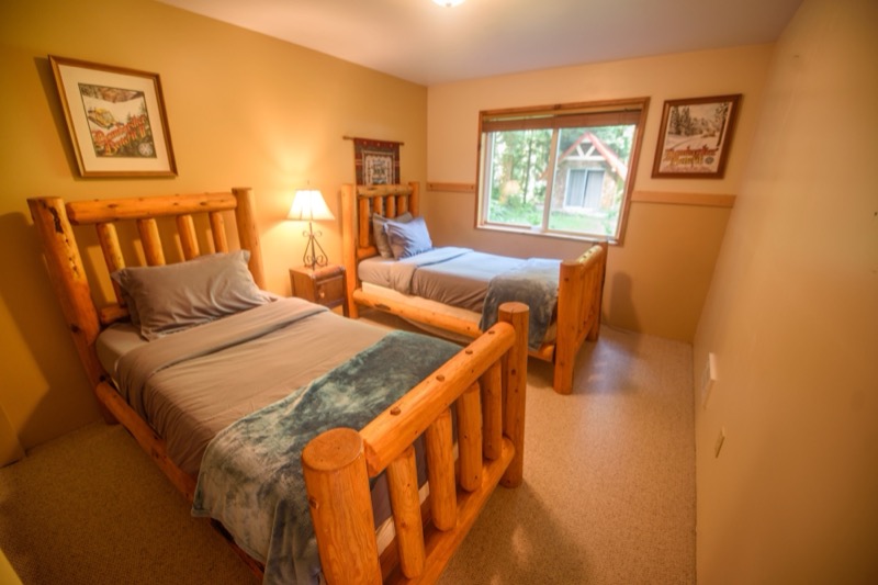 Bedroom with log bed frame