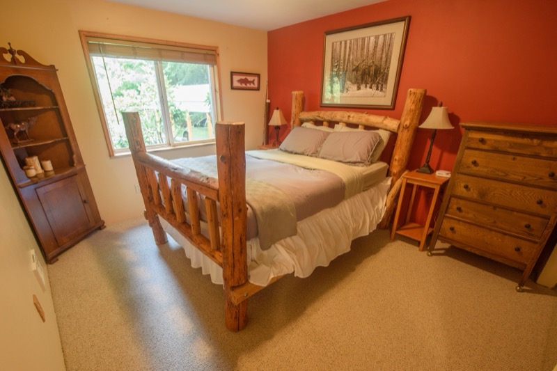 Bedroom with log bed and dresser