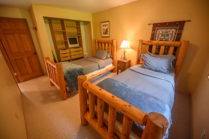 Bedroom with two log-frame beds