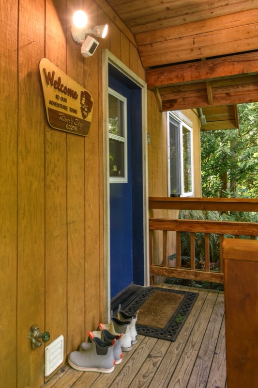 Covered front entry with welcome sign