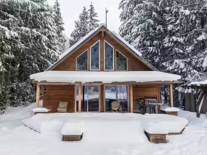 The A-frame chalet buried under heavy snow